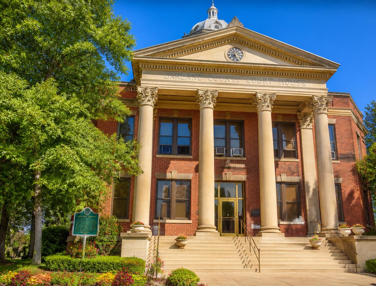 County courthouse with columns and green trees