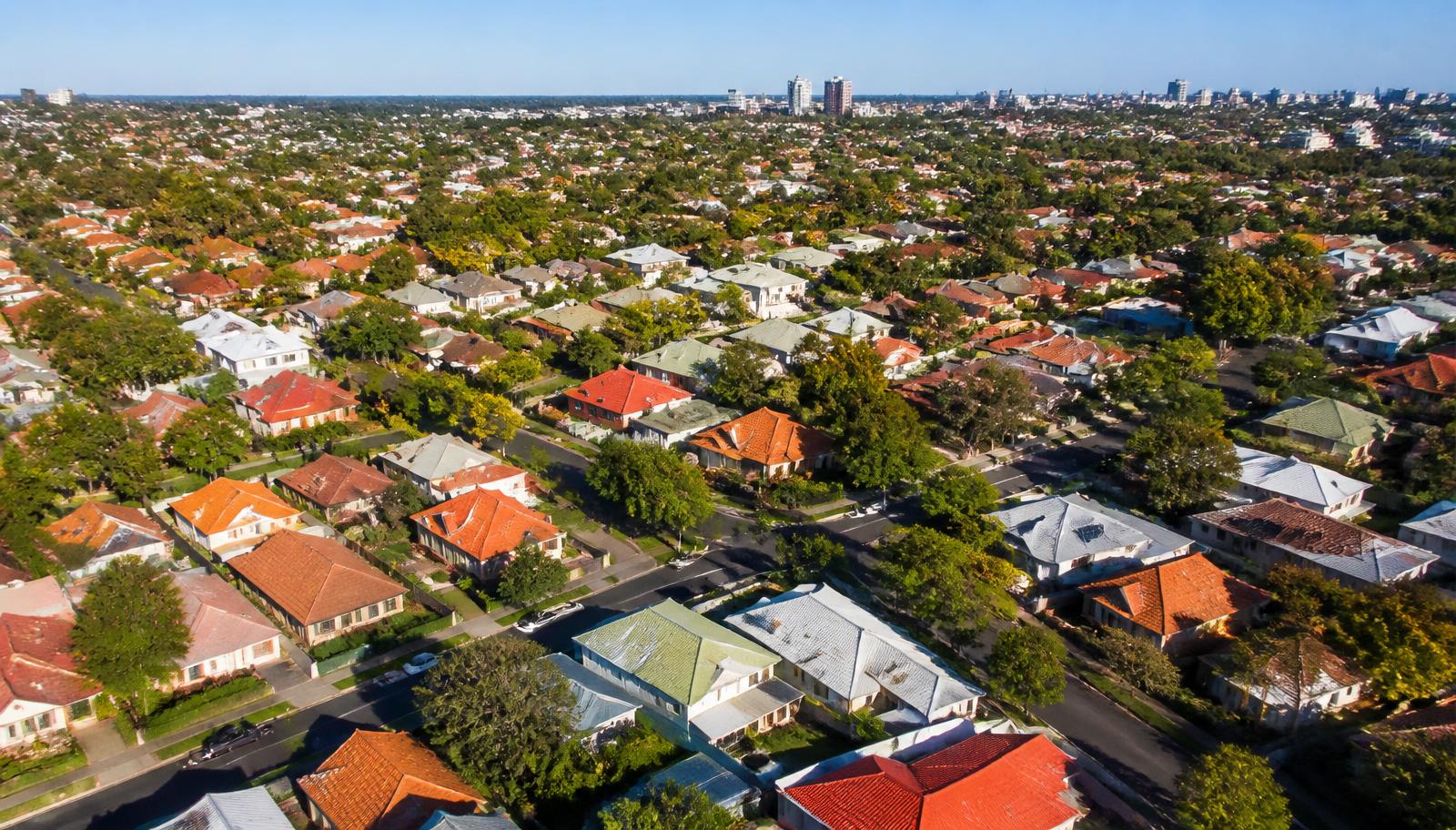 Aerial view of a suburban neighborhood with colorful rooftops